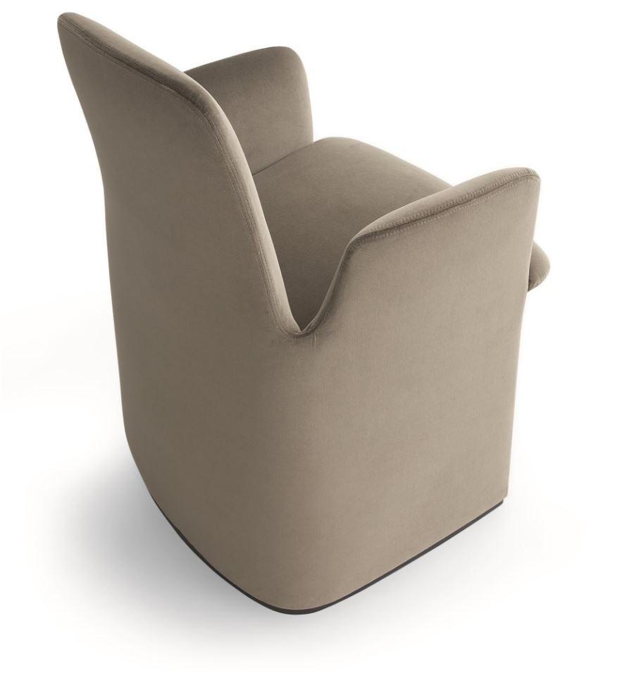 GUEST Upholstered fabric chair with armrests