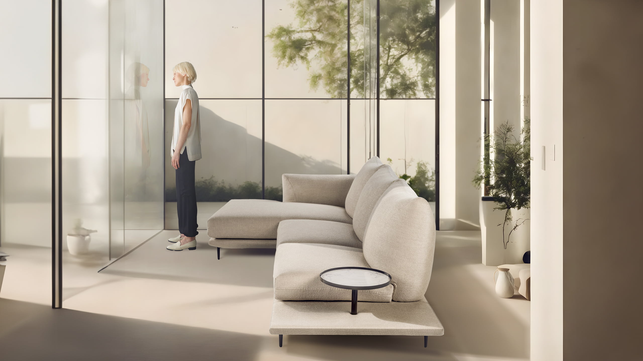 DRAGÉES Elegant sectional with heightened backrests for superior comfort, minimal base, and decorative stitching, combining sophistication with supported relaxation.