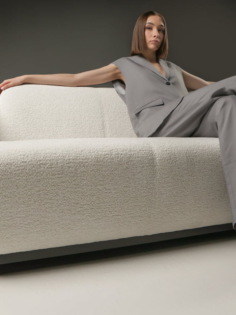 HOTEL Iconic 'Hotel' armchair with a timeless Art Deco design, renowned for comfort and versatility, available in leather or fabric, celebrated by decorators worldwide.