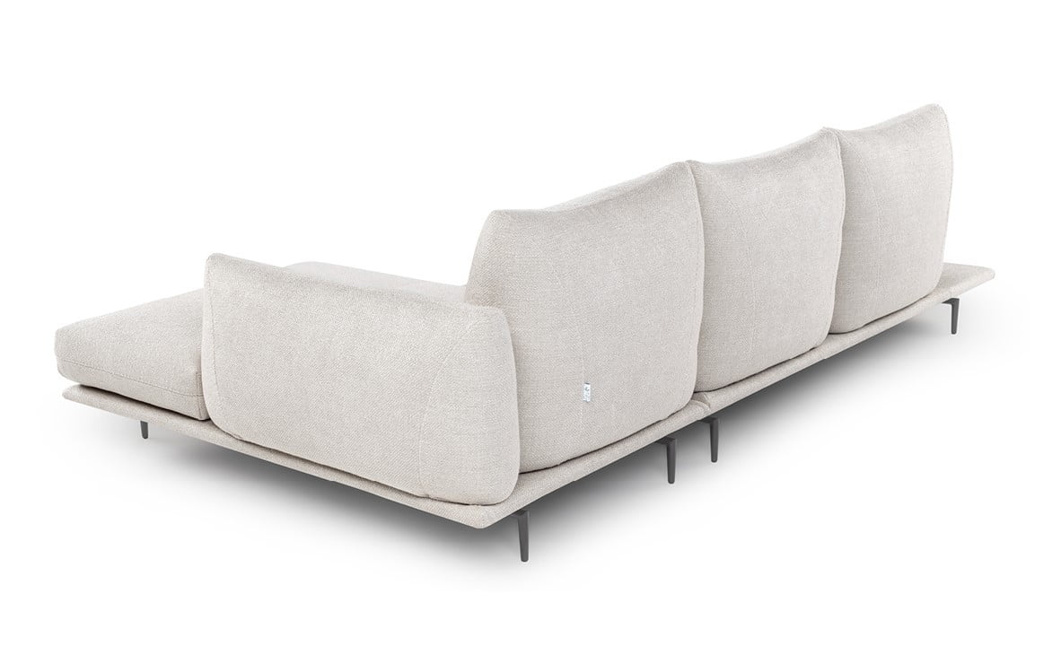 DRAGÉES Elegant sectional with heightened backrests for superior comfort, minimal base, and decorative stitching, combining sophistication with supported relaxation.